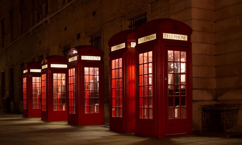 Photograph of a row of red telephone boxes 