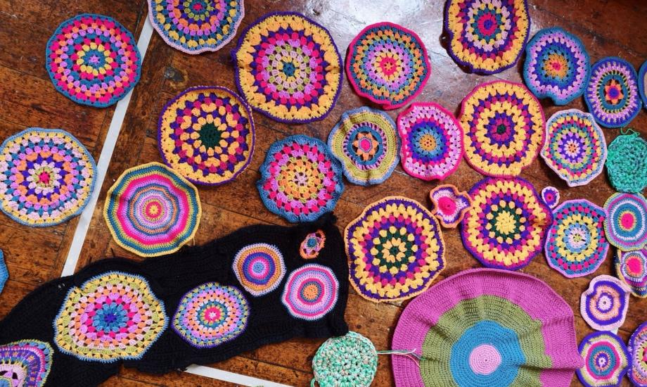 Image of several colourful crocheted mandalas 